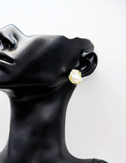Biya Accessoires abstract gold and white enamel stud earrings.