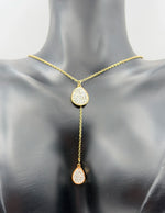 Model wearing an elegant gold lariat drop necklace in the UAE.