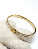 Gold bracelet with crystals on a textured white surface gift for her
