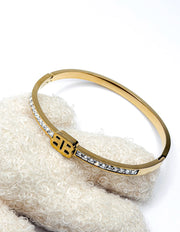 Gold bracelet with crystals on a textured white surface gift for her