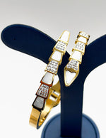 18K gold plated serpentine architectural bangle with pearl and crystals Biya Accessoires.