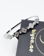 Modern luxury fine art editorial silver jewelry crystal clover bracelet gift for her.