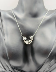 Modern luxury silver pavé clover statement necklace in gift box.