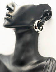 Everyday luxury fashion jewelry gold tone large hoops by Biya Accessoires Dubai.