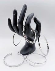 Waterproof silver architectural bangle stack Biya Accessoires UAE.