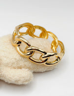 Non-tarnish thick gold statement cuff for women Dubai luxury fashion.