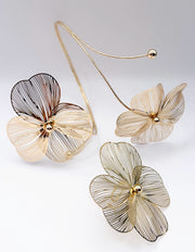 Non-tarnish wire flower statement jewelry Dubai luxury fashion.