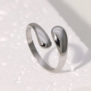 Modern luxury fine art editorial silver jewelry fluid metal ring gift for her.