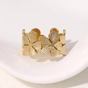 Modern luxury fine art editorial gold jewelry floral wrap ring gift for her.