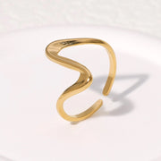 Modern luxury fine art editorial gold jewelry linear wave ring gift for her.