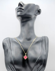 18K gold plated reversible red and crystal clover necklace by Biya Accessoires.