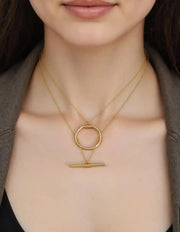 gold circle bar necklace with double chain close-up