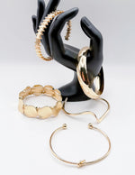 Non-tarnish layered gold bracelet set with hammered coins Dubai luxury fashion.