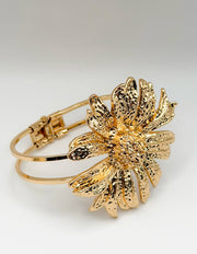 Non-tarnish textured floral gold bangle for women Dubai luxury fashion.