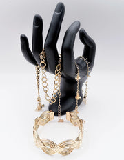 Waterproof 18K gold braided architectural bangle stack Biya Accessoires UAE.