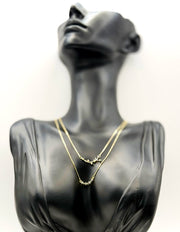 Biya Accessoires 18K gold plated layered celestial necklace with crystal stars.