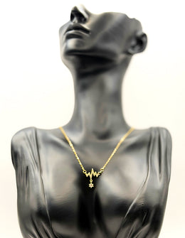 18K gold plated pavé crystal heartbeat necklace by Biya Accessoires.