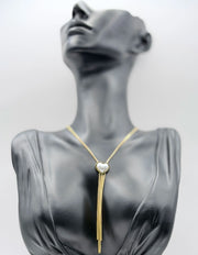 Waterproof gold Y-necklace with pearl pendant and snake chain fringe.