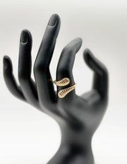 18K gold plated fluted white enamel bypass ring by Biya Accessoires.