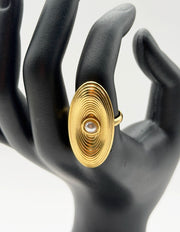Waterproof gold concentric circle shield ring with pearl Dubai.