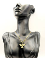 Waterproof gold flying bird necklace with pavé cubic zirconia on silk.