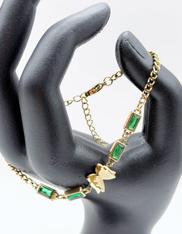 18K gold plated emerald green crystal and butterfly bracelet by Biya Accessoires.