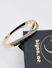 Hypoallergenic non-tarnish high polish gold twisted bangle UAE.