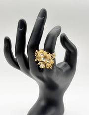 Waterproof gold large pearl coral statement ring on wood Dubai.