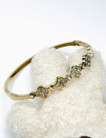 Waterproof gold quatrefoil crystal bracelet for women Dubai.