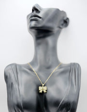 18K gold plated pavé crystal bow necklace by Biya Accessoires.