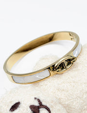 Hypoallergenic non-tarnish high polish gold architectural bangle UAE.