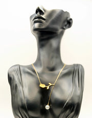 Biya Accessoires 18K gold plated tulip lariat necklace with pearl drop in green gift box.