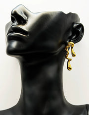 Close-up of premium hypoallergenic imitation jewelry featuring an organic molten design.