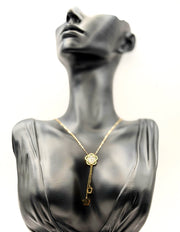 Biya Accessoires 18K gold plated flower lariat necklace with mother of pearl inlay.