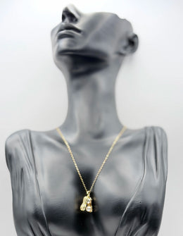 Waterproof non-tarnish artificial gold jewelry resting in a luxury green presentation box.