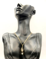 18K gold plated angel wing pendant with pear cut crystal drop by Biya Accessoires.