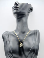 Close-up of premium hypoallergenic imitation jewelry featuring a crystal-encrusted swan.