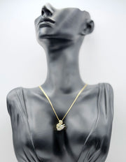 Close-up of premium hypoallergenic imitation jewelry featuring a crystal-encrusted swan.