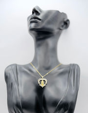 Biya Accessoires sacred heart medallion necklace with 18K gold plating and crystals.