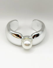 Non-tarnish thick silver statement bangle with oversized pearl Dubai luxury fashion.