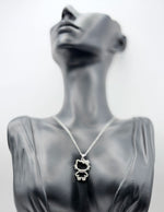 Silver plated crystal kitty silhouette pendant necklace.
