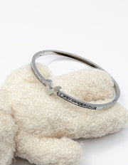 silver plated V motif chevron crystal bangle by Biya Accessoires.