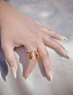 Front view of symbolic gold-plated yin-yang ring design