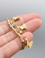 Hypoallergenic non-tarnish high polish gold butterfly bangle UAE.