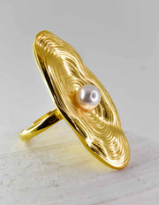 Montreal jewellery piece with pearl nestled in gold