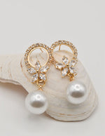 montreal trending earrings with pearl drops and floral crystal stud design