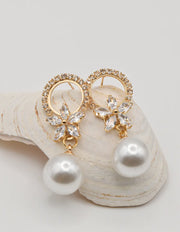 montreal trending earrings with pearl drops and floral crystal stud design