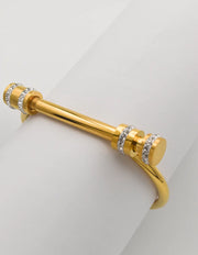 Montreal-inspired permanent bracelet stacked with rings