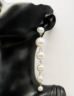 Everyday luxury fashion jewelry silver tone pearl dangles by Biya Accessoires Dubai.