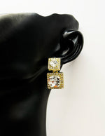 Close up of imitation jewelry uae statement drops featuring clear diamond-cut stones.